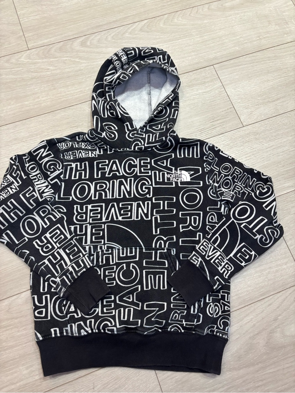 The North Face Kids All‑Over Logo Hoodie Black (Size Medium)